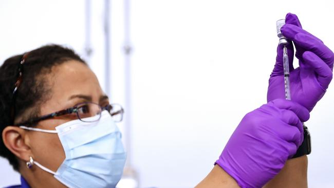 A New Orleans pharmacist prepares a dose of the Pfizer Covid-19 vaccine. Picture: AFP