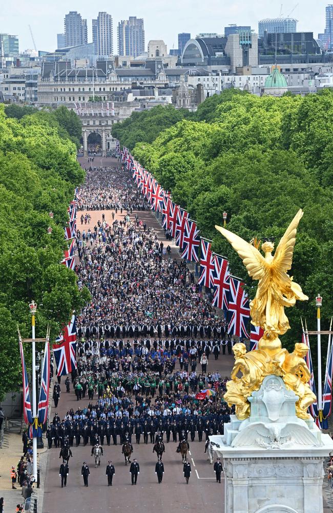 Members of the public fill The Mall ahead of a flypast over Buckingham Palace during Trooping the Colour. Picture: Getty