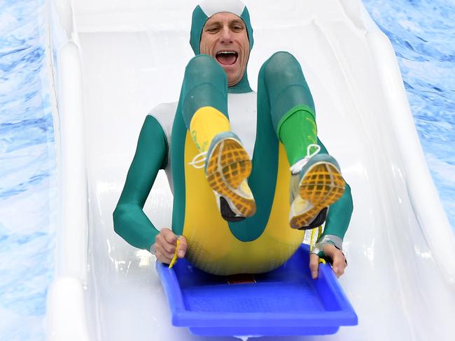 Steve Moneghetti takes the plunge into the Big Freeze 3 pool on Monday.