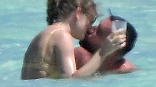 Taylor Swift and Travis Kelce share steamy kiss in the Bahamas during beach  holiday | Daily Telegraph