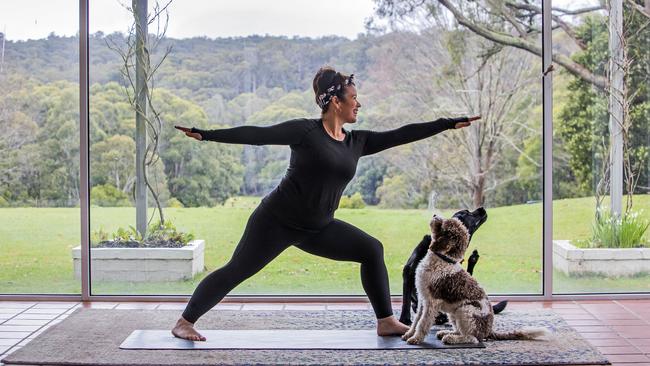 Penny Loscaso at her home in Bullengarook near Gisborne with her dogs Tilly and Max. Picture: Aaron Francis/The Australian