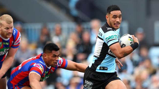 SYDNEY, AUSTRALIA — AUGUST 26: Valentine Holmes of the Sharks makes a break during the round 24 NRL match between the Cronulla Sharks and the Newcastle Knights at Southern Cross Group Stadium on August 26, 2018 in Sydney, Australia. (Photo by Cameron Spencer/Getty Images)