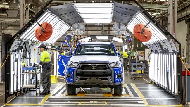 Workers build HiLux Rogue and HiLux Rugged X at the Toyota Conversions production line at the Toyota Centre of Excellence.