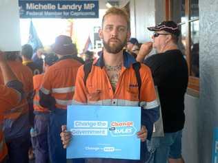 Scott Treacy protests outside MP Michelle Landry's office during Wednesday's Change the Rules protest. Picture: Jann Houley