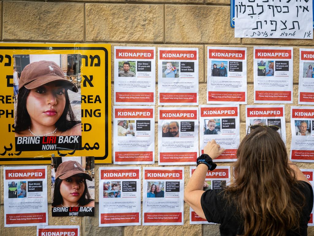 Dozens of people have been abducted by Hamas attackers and their loved ones are sharing their images on a wall in Tel Aviv. Picture: Getty