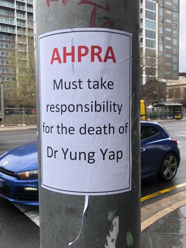 Posters have been placed in the city blaming AHPRA for Dr Yap’s death.