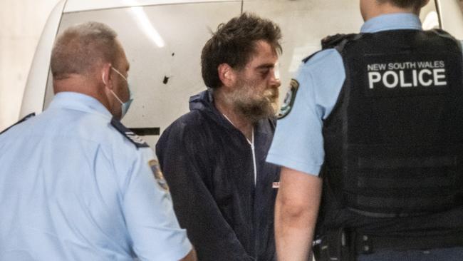 Bradley Howard, pictured, seen arriving at Burwood Local Court. He has been charged after allegedly brandishing an axe after being almost knocked off his bike. Picture: NCA NewsWire/James Gourley