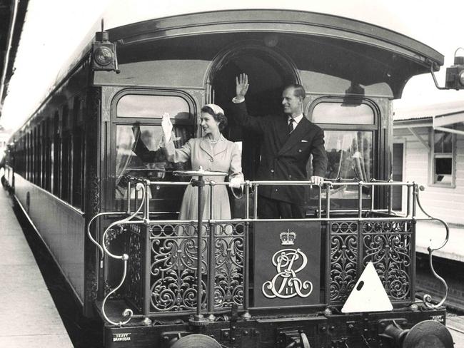 Queen Elizabeth II and Prince Phillip on the royal train at Central Railway Station, Sydney February 9 1954. More than 25,000 people waited up to three hours to catch a glimpse of the royal couple. Picture: NSW State Archives