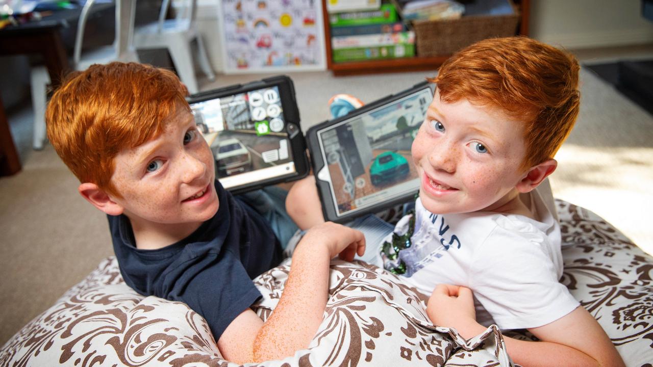 Brothers Tommy, 8, and Ollie, 5, were both given iPads during lockdown to keep in touch with friends. Picture: Mark Stewart