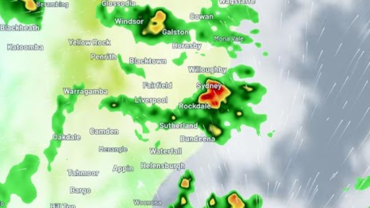 A fast burst of heavy rain and hail fell over Sydney, drenching the city and its surrounds in the space of just minutes, as the state deals with a ‘trail of carnage’ left by heavy rains and flash floods. Picture: Weatherzone