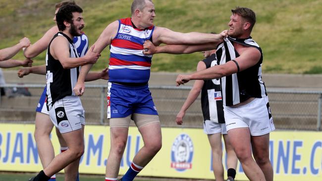 Point Cook’s Kirk Hebele and Parkside’s Ben Papal lock horns. Picture: Mark Dadswell