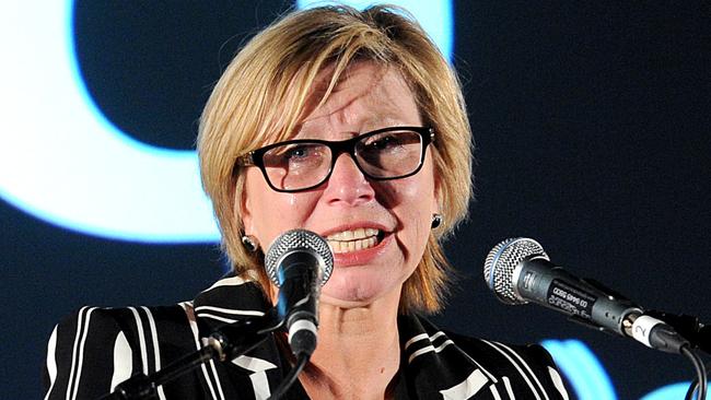 Australian of the Year Rosie Batty cries on stage during her speech at a White Ribbon Day at Broadmeadows town hall with the Governor General Sir Peter Cosgrove in Melbourne, on Wednesday Nov. 25, 2015. (AAP Image/Joe Castro) NO ARCHIVING