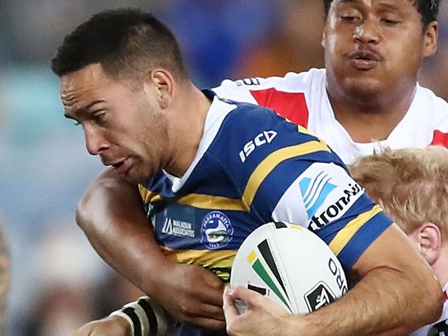 SYDNEY, AUSTRALIA - AUGUST 11:  Corey Norman of the Eels is tackled during the round 22 NRL match between the Parramatta Eels and the St George Illawarra Dragons at ANZ Stadium on August 11, 2018 in Sydney, Australia.  (Photo by Mark Metcalfe/Getty Images)