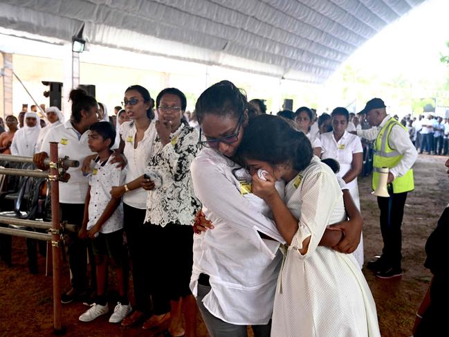 Two women weep  during a funeral service for bomb blast victims at St Sebastian's Church in Negombo. Picture: AFP