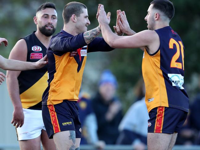 Nicholas Grabowski of East Keilor celebrates a goal with teammates during the EDFL football match between East Keilor and Westmeadows played at Overland Reserve Keilor on Saturday 20th July, 2019