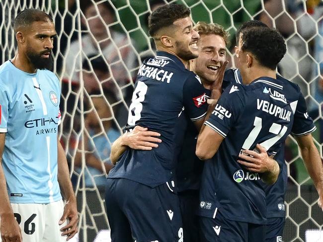 MELBOURNE, AUSTRALIA - OCTOBER 26: mv6is congratulated by team mates after scoring a goal during the round two A-League Men match between Melbourne City and Melbourne Victory at AAMI Park, on October 26, 2024, in Melbourne, Australia. (Photo by Quinn Rooney/Getty Images)