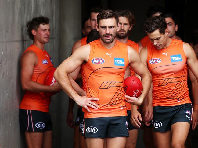 Stephen Coniglio of the Giants leads teammates onto the field.