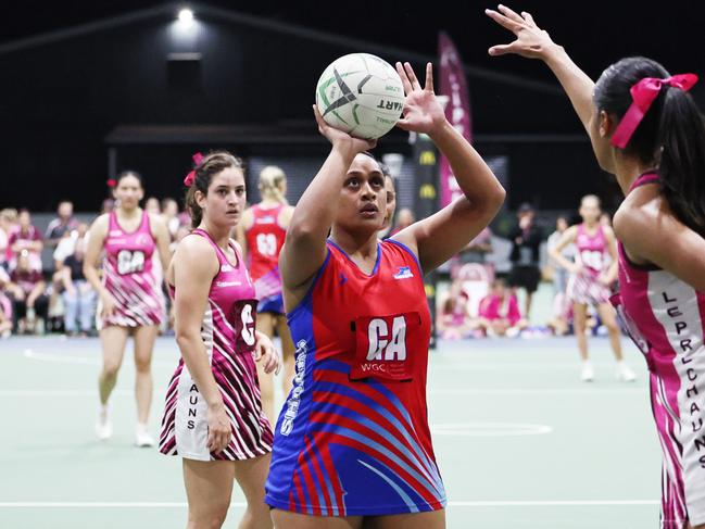 Sharks' Rachel Fa'anana shoots a goal in the Cairns Netball Division 1 grand final match between the WGC Sharks and the Cairns Leprechauns. Picture: Brendan Radke