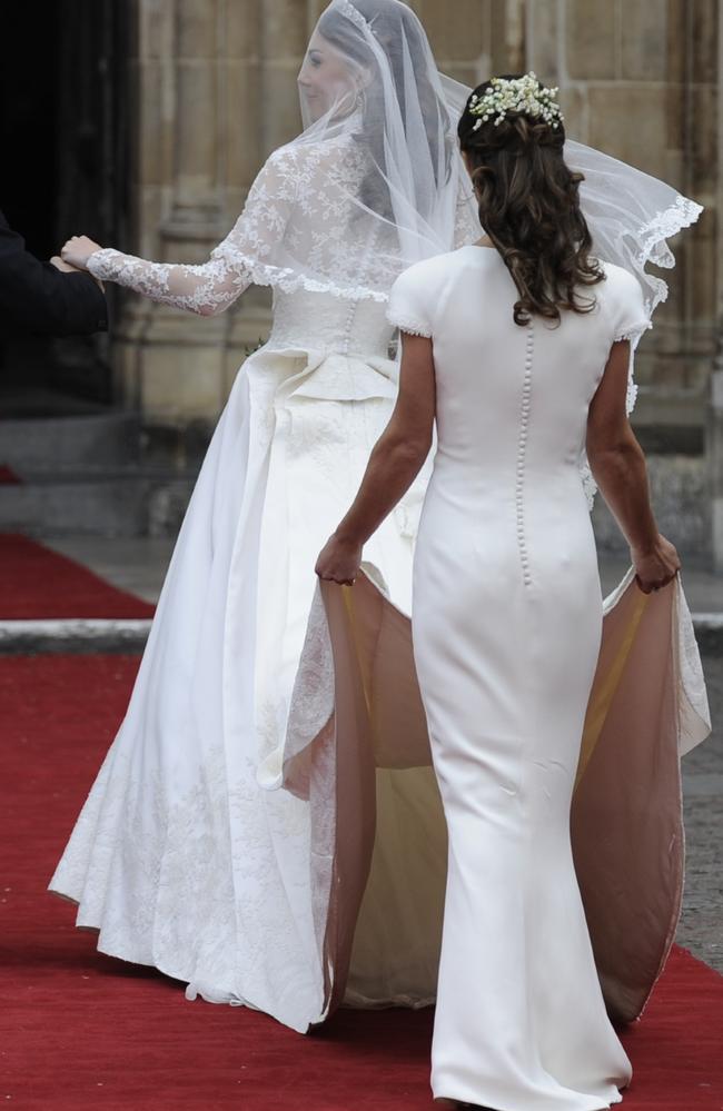 Bottom stole the Royal Wedding spotlight ... Kate Middleton arrives at Westminster Abbey, London, with her sister Pippa for her marriage to Prince William. Picture: News Corp Australia