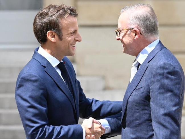 France's President Emmanuel Macron (L) waves as he welcomes Australia's Prime Minister Anthony Albanese (R) prior to a working lunch at the presidential Elysee Palace in Paris on July 1, 2022.  Picture: Supplied by the PMO