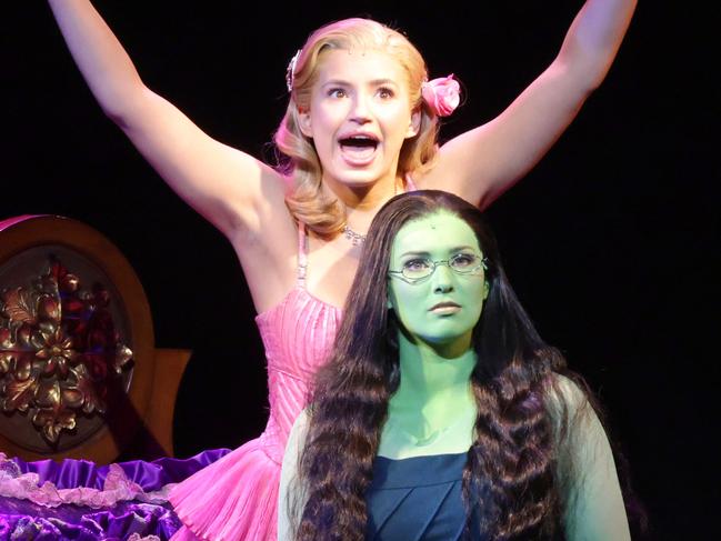 Courtney Monsma as Glinda (pink/yellow) with Sheridan Adams as Elphaba (black with green skin), they are the stars of Wicked, Lyric Theatre, QPAC, South Brisbane, on Friday September 13th 2024 - Photo Steve Pohlner