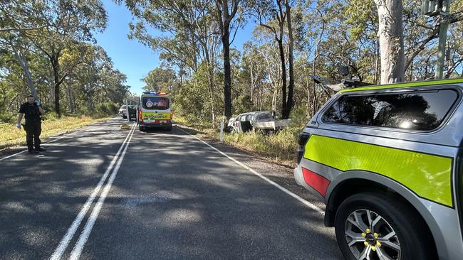 Emergency services are working to free two people after their car crashed into a tree at Cooroibah on Tuesday. Picture: Contributed