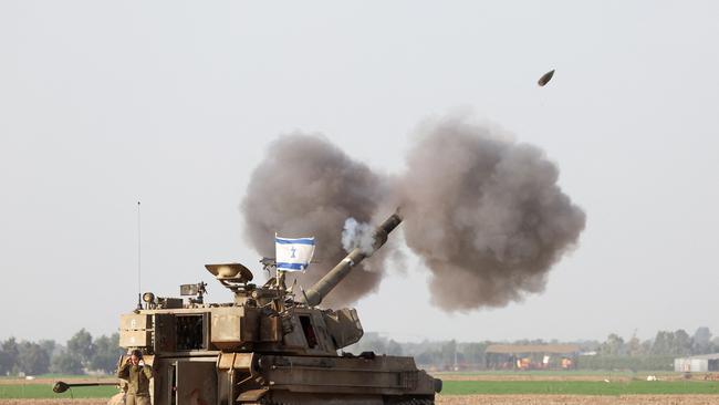 An Israeli howitzer fires towards Gaza on December 12, amid continuing battles between Israel and the militant group Hamas. Picture: AFP