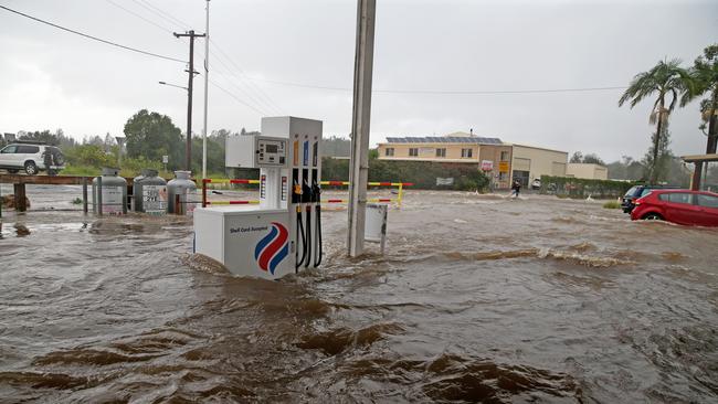 A petrol station at Telegraph Point was inundated with flood waters on Friday evening. Picture: Nathan Edwards