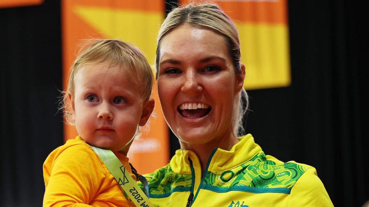 BIRMINGHAM, ENGLAND - AUGUST 07: Gretel Bueta of Team Australia poses for a photo with their son Bobby during the Netball Medal Ceremony on day ten of the Birmingham 2022 Commonwealth Games at NEC Arena on August 07, 2022 on the Birmingham, England. (Photo by Matthew Lewis/Getty Images)