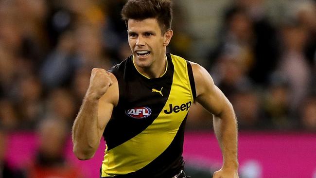 Trent Cotchin celebrates a goal against Collingwood.