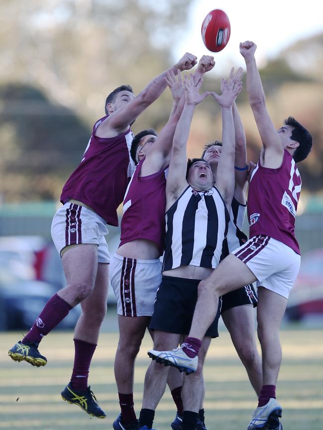 Salisbury players fly for the ball in a game against Colonel Light Gardens last year. Picture: AAP/James Elsby.