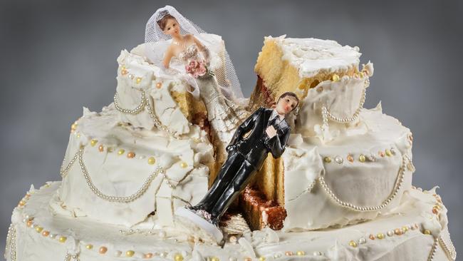 Spouses always seem to struggle to keep their relationship alive. divorce generic wedding cake.