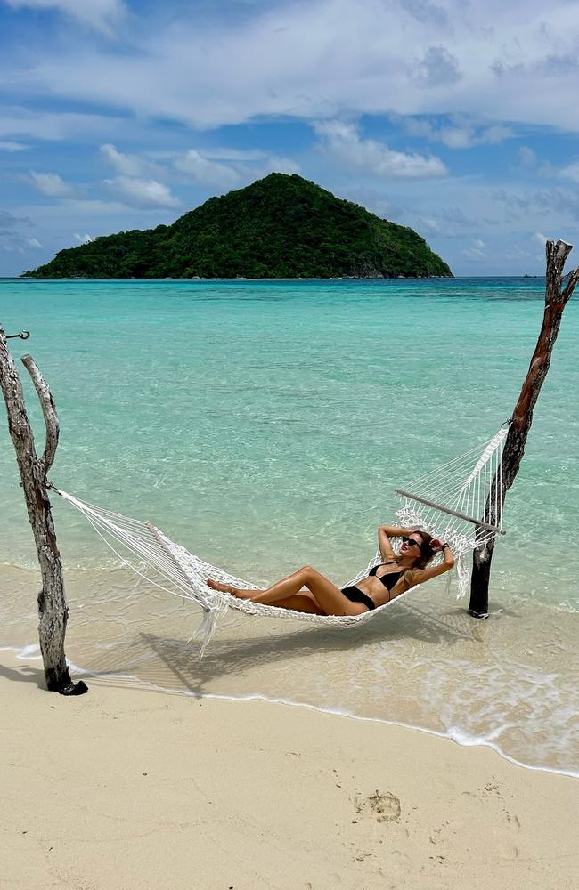 Judd and her husband also visited a private island in Bawah, Indonesia, where she soaked up the sun in a hammock over the water. Picture: Instagram/@becjudd