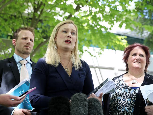 Former Glenorchy mayor Kristie Johnson, centre, speaks about the Board of Inquiry report, flanked by former aldermen Matthew Stevenson, left, and Jan Dunsby. Picture: LUKE BOWDEN