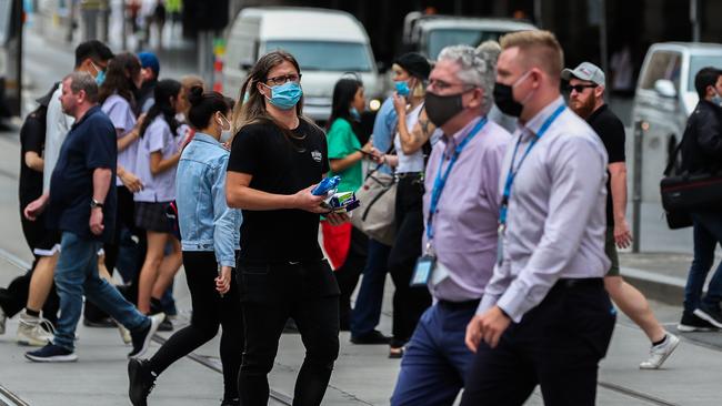 Masks were back on across Melbourne on Thursday. Picture: Getty Images