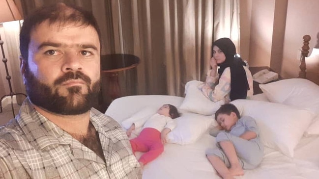 Khalid with his son Angiza, 4 and daughter Aqsa, 1 in Australian hotel quarantine after fleeing Afghanistan. Picture: Supplied