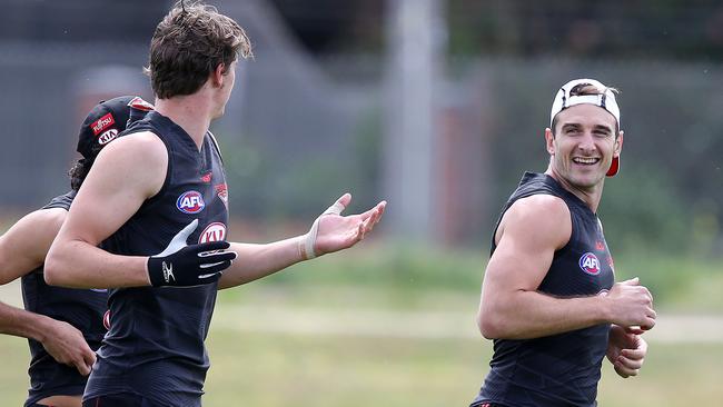 Jobe Watson talks to Joe Daniher during an Essendon pre-season training session last week. Picture: Michael Klein