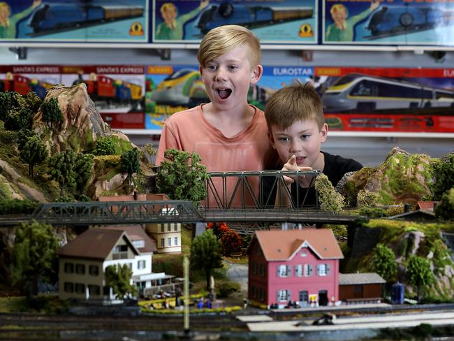 Brothers (L-R) Maverick (11) and Nash (8) Barry enjoy watching the model trains go around at HobbyCo toy store in the QVB today. Jane Dempster/The Australian