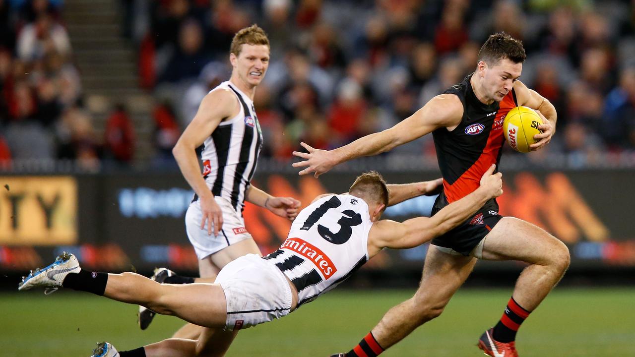 Conor McKenna evades Taylor Adams during a game at the MCG.