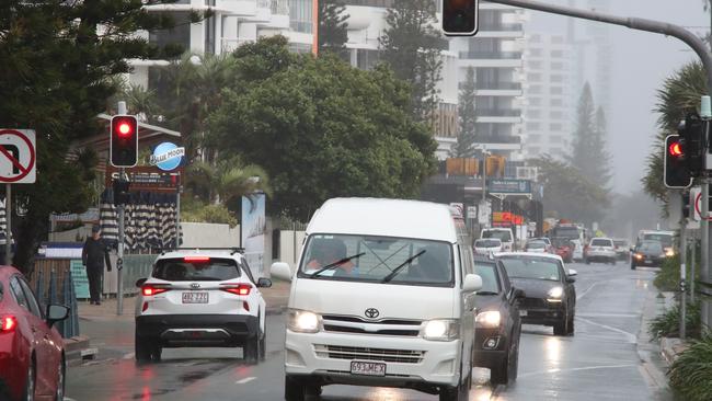 Surfers Paradise wakes up to its first day in lockdown due to the latest CoVid-19 scare. Tradesman still at work at Paradise Centre. Still traffic around.... Picture Glenn Hampson