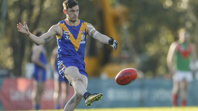 Cranbourne’s Tom Marks takes a kick against Tooradin-Dalmore in the SEFNL this season. Picture: Valeriu Campan