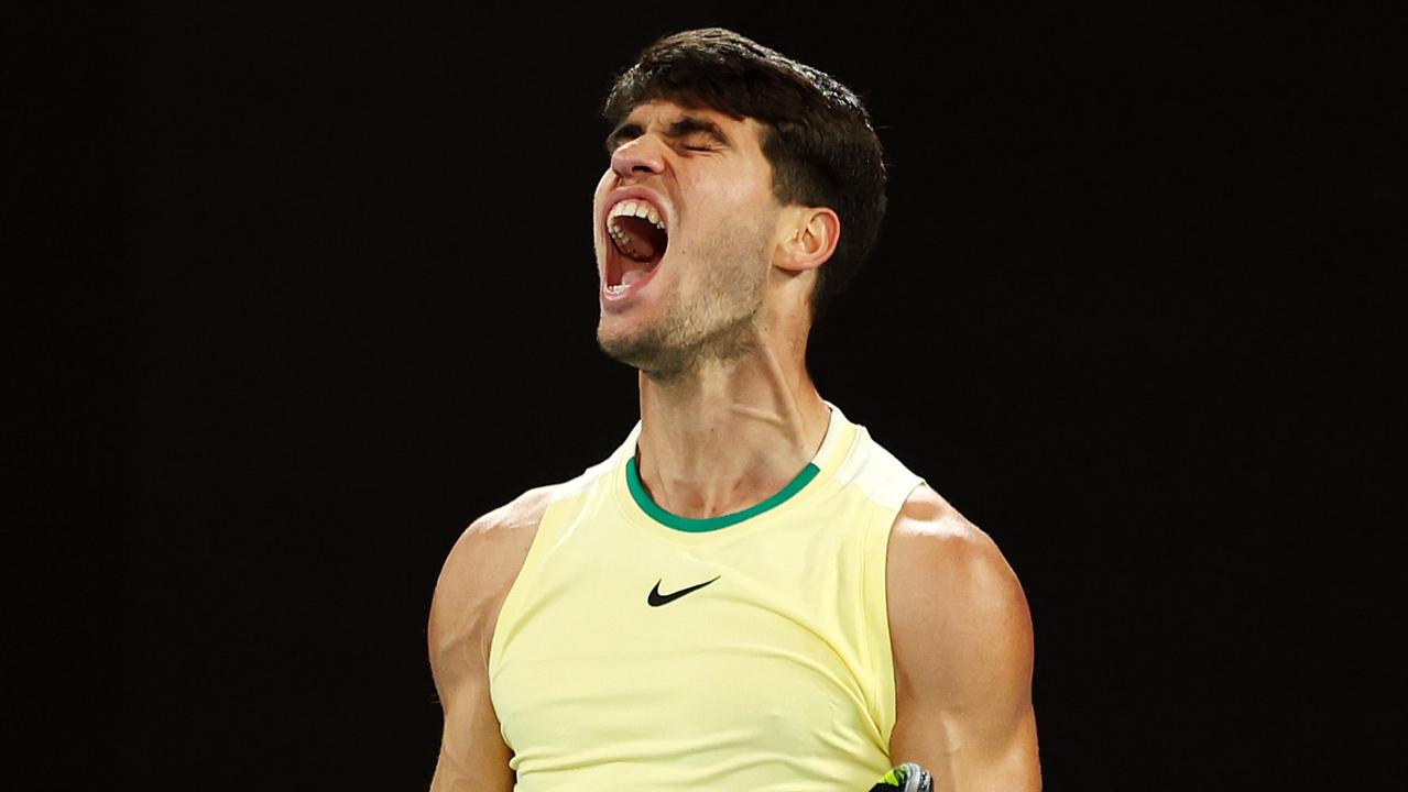 MELBOURNE, AUSTRALIA - JANUARY 22: Carlos Alcaraz of Spain celebrates a point during their fourth round singles match against Miomir Kecmanovic of Serbia during the 2024 Australian Open at Melbourne Park on January 22, 2024 in Melbourne, Australia. (Photo by Graham Denholm/Getty Images)