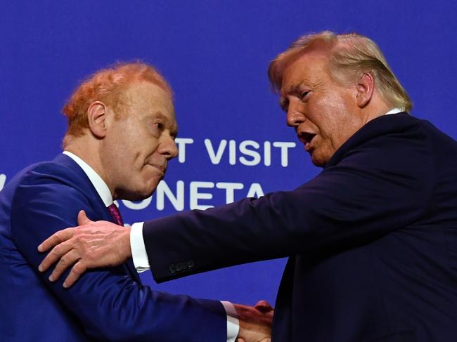 US President Donald Trump greets billionaire  Anthony Pratt at the opening of Pratt Paper Plant in Wapakoneta, Ohio, United States, Sunday, September 22, 2019. (AAP Image/Mick Tsikas) NO ARCHIVING