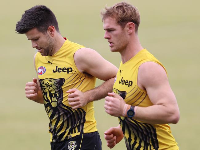 Trent Cotchin runs laps with David Astbury. Picture: Michael Klein