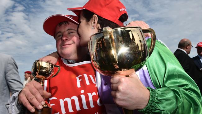 Michelle Payne, right, celebrates with her brother and Prince Of Penzance’s strapper Steven after the Cup.