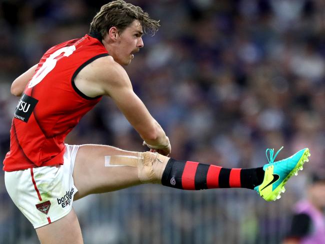 Joe Daniher of the Bombers kicks the ball during the Round 2 AFL match between the Fremantle Dockers and the Essendon Bombers at Optus Stadium in Perth, Saturday, March 31, 2018. (AAP Image/Richard Wainwright) NO ARCHIVING, EDITORIAL USE ONLY