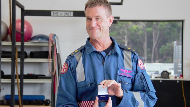 The paramedic was presented with a medal to mark his 40 years of service. Picture: Madeline Crittenden