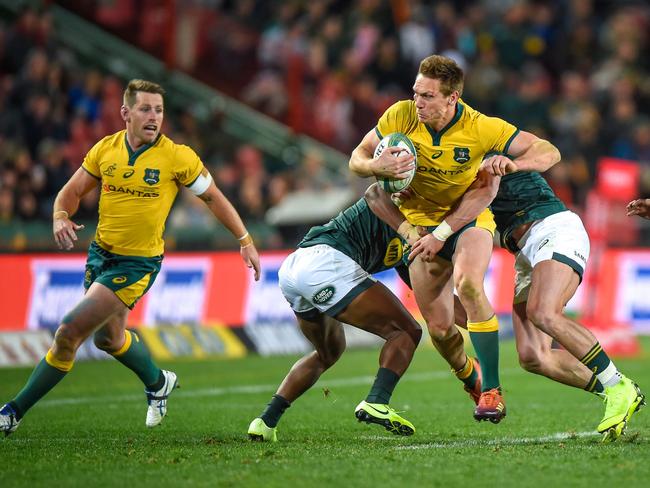 Australia's Dane Haylett-Petty (C) is tackled by South Africa's Warrick Gelant (L) and South Africa's Jesse Kriel (R). Picture: Christiaan Kotze/AFP