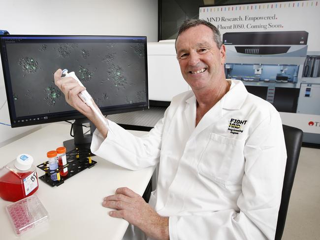 Neale Daniher dons a lab coat to check out the new MND Lab at the Florey Institute of Neuroscience and Mental Health. Picture: David Caird