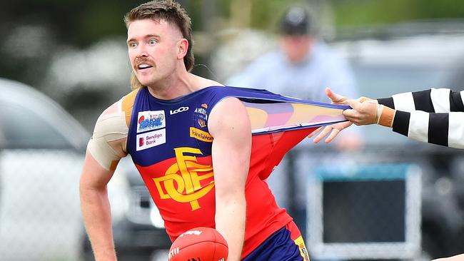 Mitchell Day of Diggers Rest is tackled by Owen Fowler of Wallan during the round two RDFNL Bendigo Bank Seniors match between Diggers Rest and Wallan at Diggers Rest Recreation Reserve, on April 13,2024, in Diggers Rest, Australia. (Photo by Josh Chadwick)